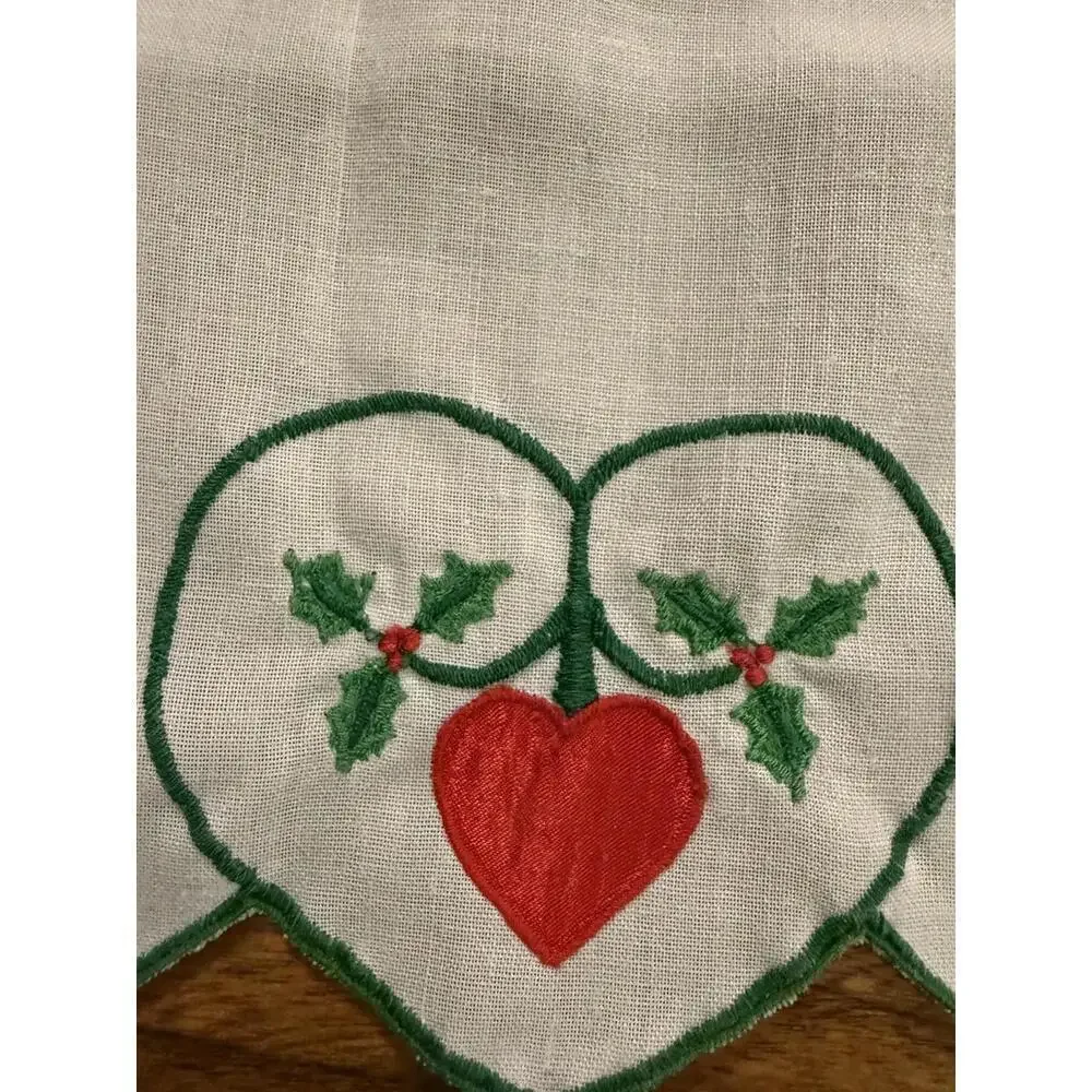 Table runner appliqued with red hearts and embroidered holly leaves 88” X 13.5”